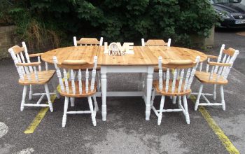 Image of a wooden dining room table and 6 chairs