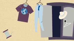 A grey wardrobe with a purple t-shirt with an image of the earth on, a pair of light blue trousers, a cream sunhat, a white hanger, and a spool of thread. 