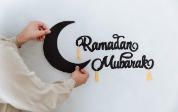 Ramadan Mubarak sign with crescent moon being stuck to the wall