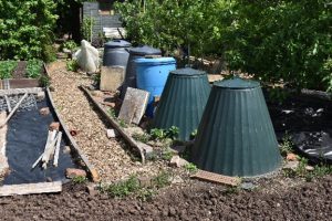 A row of dalek style compost bins