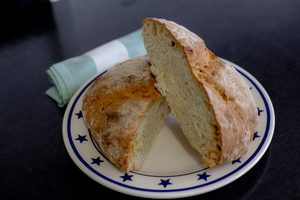 Irish scone bread cut in half on a plate