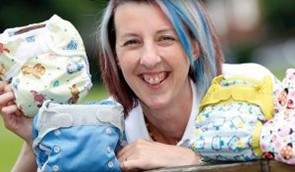 A woman holding reusable nappies