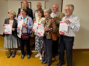 A group of long serving EAVs receiving certificates to mark 5 or more years of voluntary service.