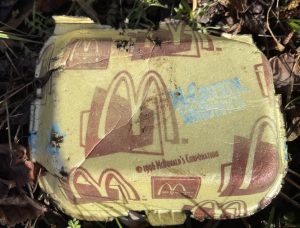 Polystyrene food packaging from 1996 that has been littered on a public highway.